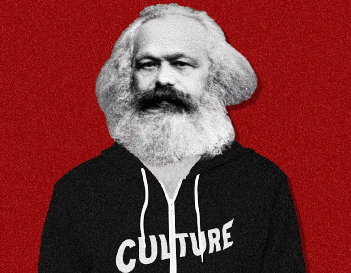 Karl Marx wearing a hoodie that says culture in front of a red background